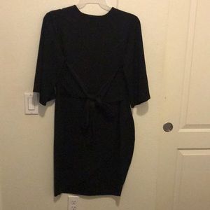 This is a dress that ties into a bow in the tummy section..